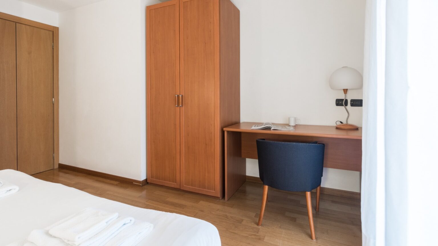 camera da letto in trilocale in Valmalenco