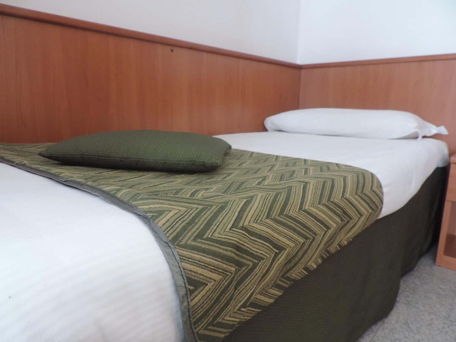 letto singolo in appartamento monolocale in Valmalenco